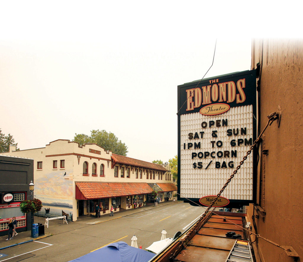 The Edmonds Theater is nearly as old as Hollywood’s movie industry. It was open only for popcorn sales on weekends, before movie theaters were allowed to reopen at 25% capacity. (Kevin Clark / The Herald)
