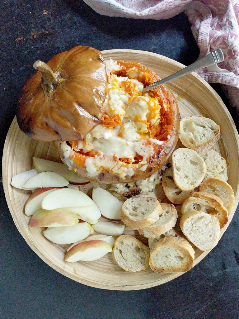 Roasted cheese pumpkin is stuffed with Gruyere and Swiss cheeses, cream and white wine for a creamy side dish or appetizer. (Gretchen McKay / Pittsburgh Post-Gazette)
