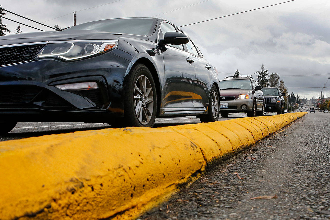 The median curb on northbound Highway 99 at 112th Street SW got a fresh paint job earlier this month. (Kevin Clark / The Herald)