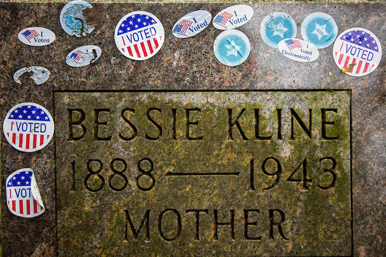 The gravestone of suffragist Bessie Kline covered in "I VOTED" stickers at the Evergreen Cemetery on Wednesday, Nov. 4, 2020 in Everett, Wa. (Olivia Vanni / The Herald)
