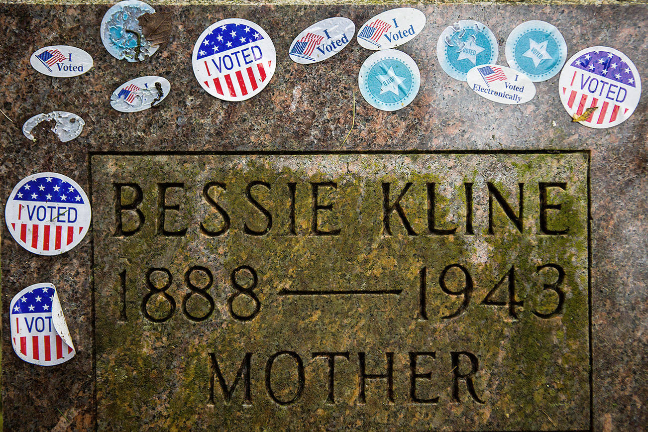 The gravestone of suffragist Bessie Kline covered in "I VOTED" stickers at the Evergreen Cemetery on Wednesday, Nov. 4, 2020 in Everett, Wa. (Olivia Vanni / The Herald)