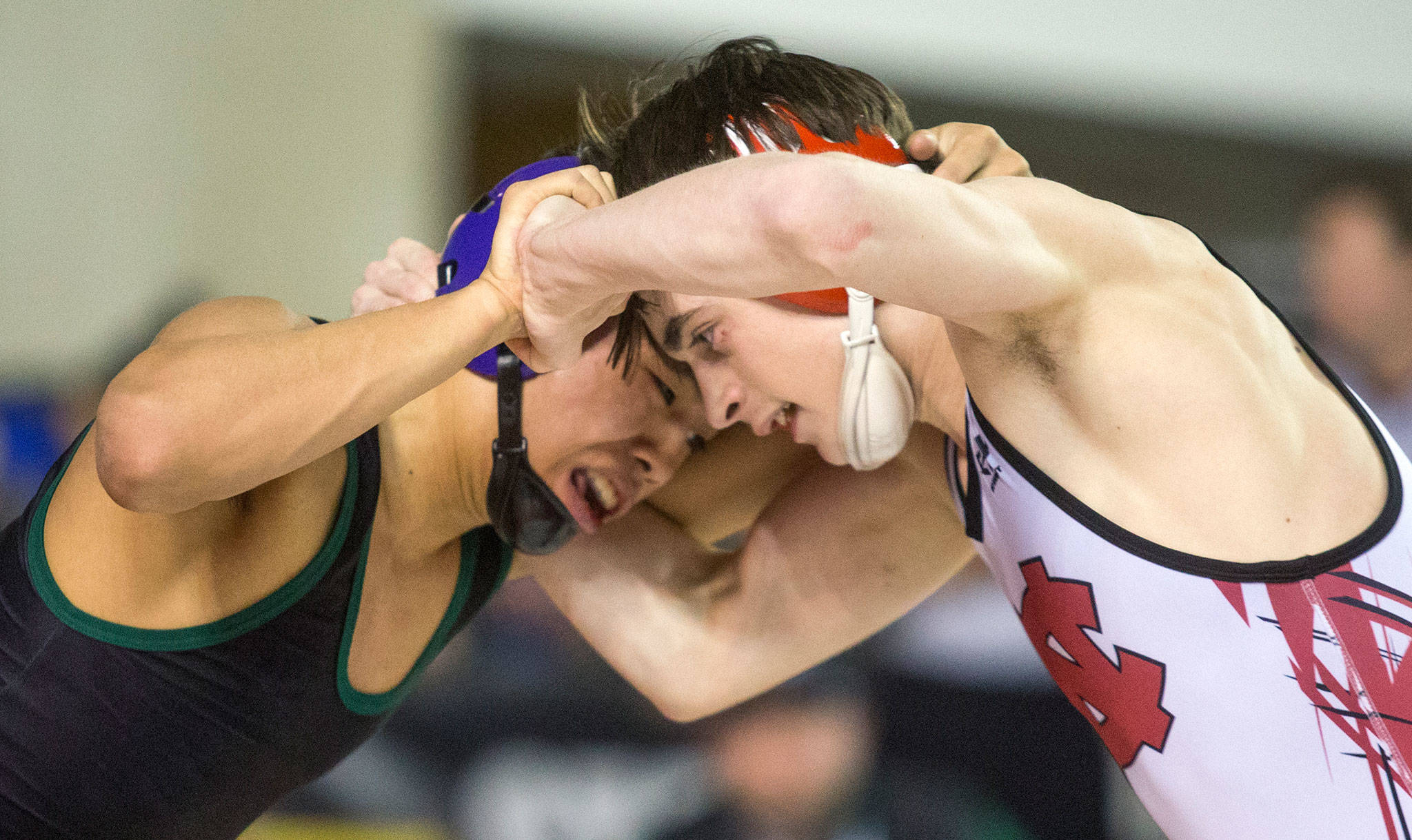 Edmonds-Woodway’s Ethan Nguyen (left) battles North Central’s Steven Zaragoza at Mat Classic XXXII on Feb. 22, 2020, at the Tacoma Dome. (Andy Bronson / The Herald)
