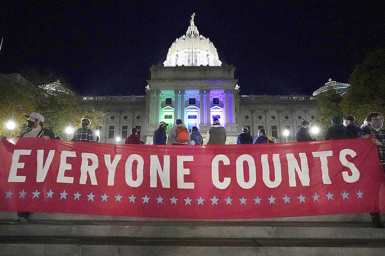 People demonstrate outside the Pennsylvania State Capitol to urge that all votes be counted, Wednesday, Nov. 4, 2020, in Harrisburg, Pa., following Tuesday's election. (AP Photo/Julio Cortez)