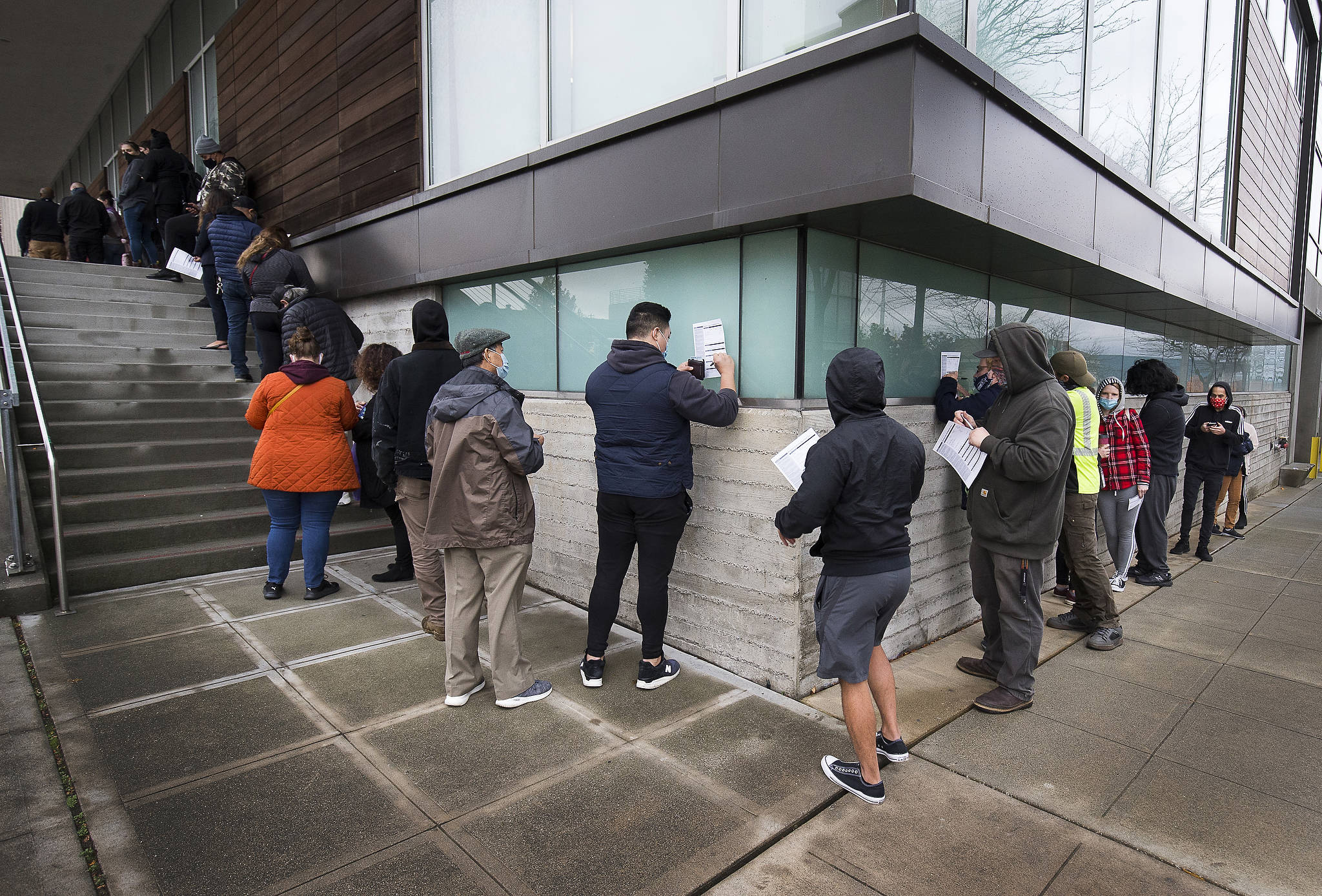 Voters stand in line to get their ballots at the Robert J. Drewel Administration Building on the Snohomsish County Campus on Tuesday in Everett. (Andy Bronson / The Herald)