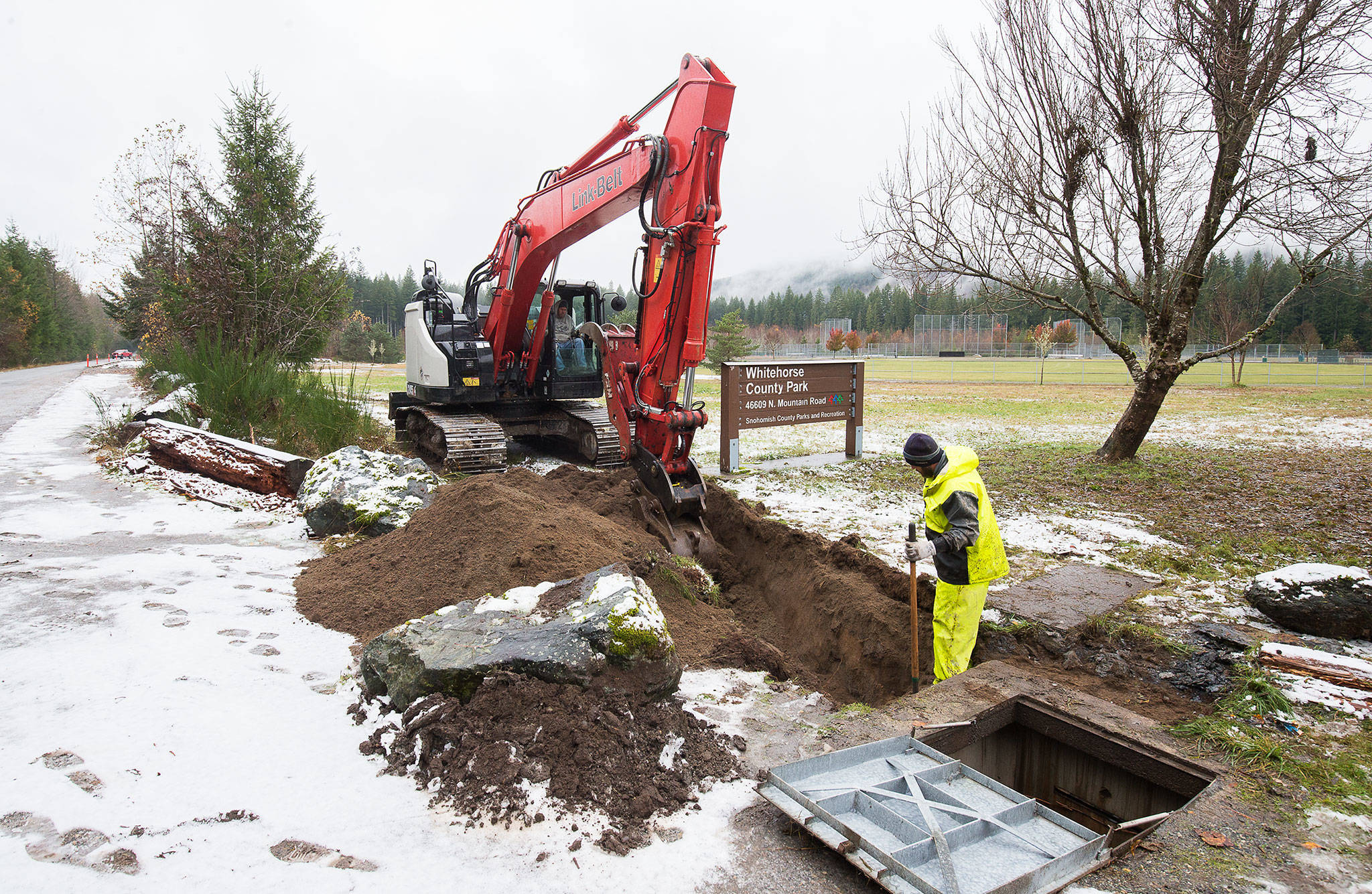 Workers from Konnerup Construction work at Whitehorse Community Park near Darrington, which will have the first equestrian campsites in Snohomish County. (Andy Bronson / The Herald)