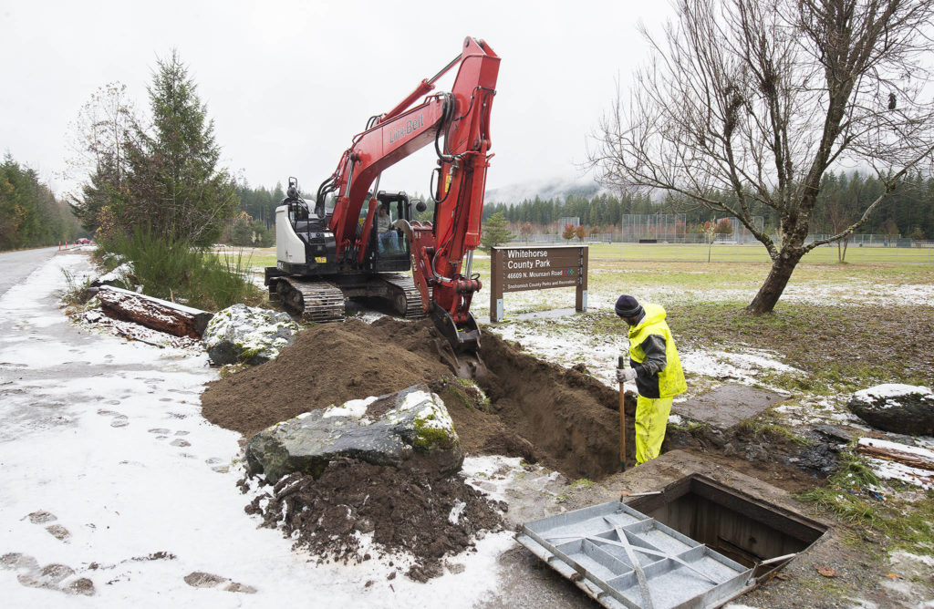 Workers from Konnerup Construction work at Whitehorse Community Park near Darrington, which will have the first equestrian campsites in Snohomish County. (Andy Bronson / The Herald)
