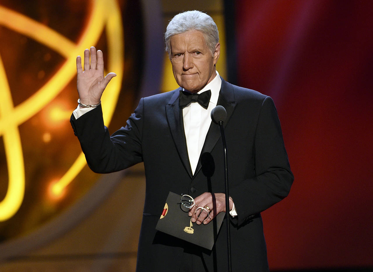 This May 5, 2019 photo shows Alex Trebek presenting an award at the 46th annual Daytime Emmy Awards in Pasadena, California. (Photo by Chris Pizzello/Invision/AP, File)
