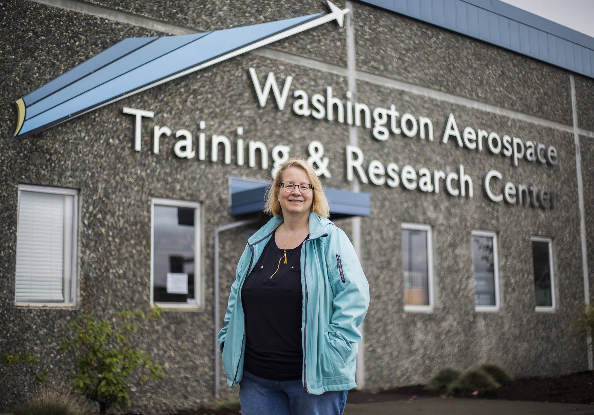 Melanie Evans stands outside the Washington Aerospace Training Research Center in Everett, where she received her Quality Assurance Certificate. (Olivia Vanni / The Herald)