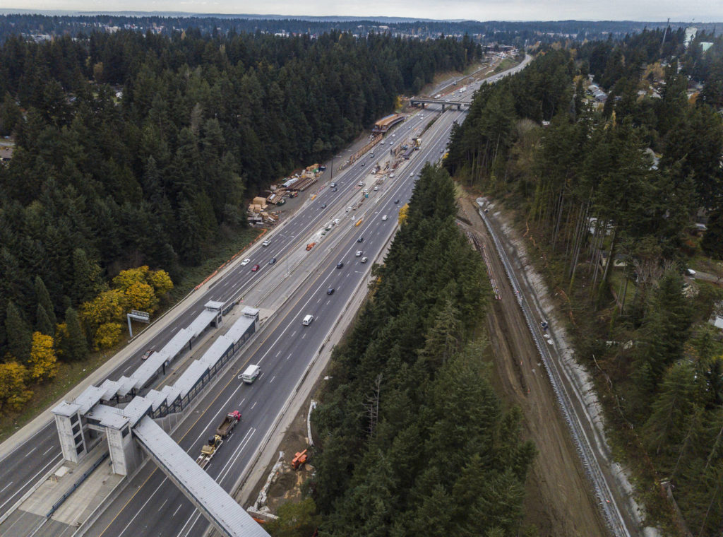 Cars on I-5 pass Sound Transit construction of the Link light rail line. The freeway will be closed at night, on a weekend, so crews can prepare supports for the elevated rail line. (Olivia Vanni / The Herald)
