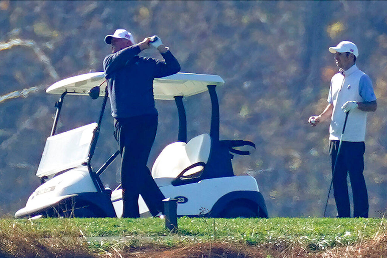 President Donald Trump plays a round of Golf at the Trump National Golf Club in Sterling Va., Sunday Nov. 8, 2020. (AP Photo/Steve Helber)