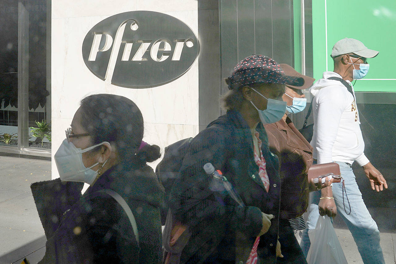 Pfizer says an early peek at its vaccine data suggests the shots may be 90% effective at preventing COVID-19, but it doesn’t mean a vaccine is imminent. (Associated Press)