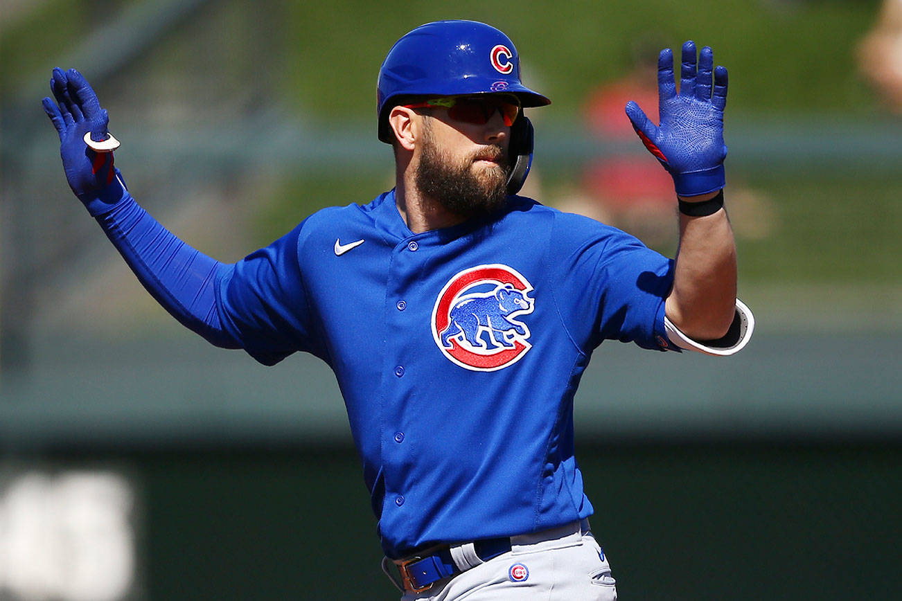 Chicago Cubs' Steven Souza Jr. calls for a timeout as he stands on second base after connecting for a double against the Colorado Rockies during the first inning of a spring training baseball game Tuesday, March 3, 2020, in Scottsdale, Ariz. (AP Photo/Ross D. Franklin)