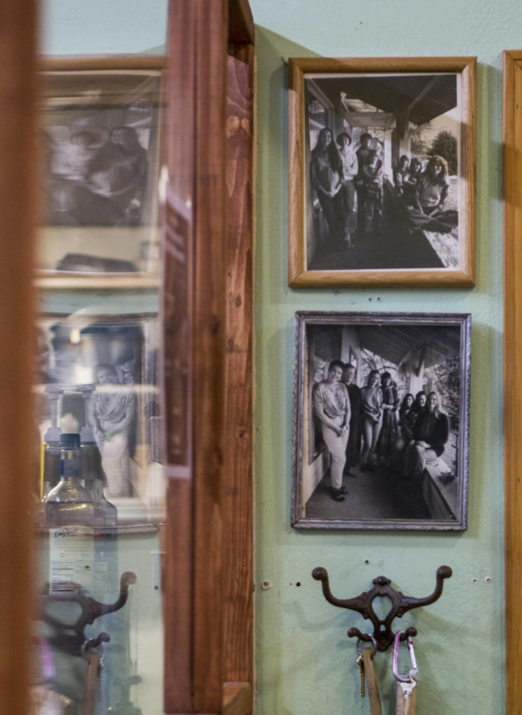 Photographs of “the Sisters” hang next to the front counter on Tuesday in Everett. (Olivia Vanni / The Herald)
