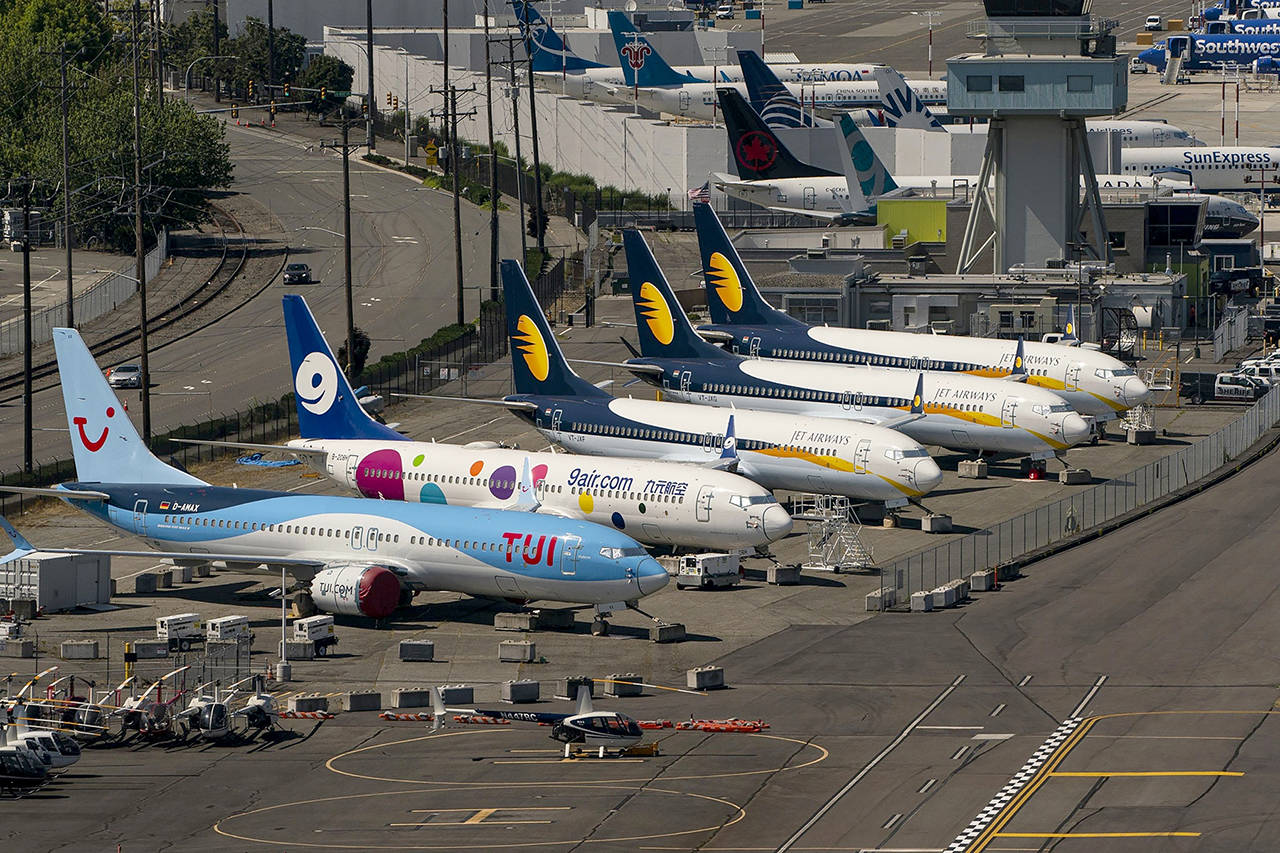 Boeing 737 Max airplanes are parked at Boeing Field in Seattle on July 27. (David Ryder/Bloomberg)