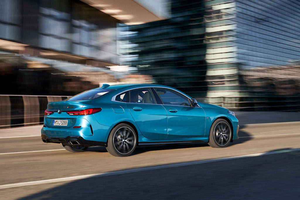 A low-slung stance, sloping roof, and frameless windows highlight the BMW M235i Gran Coupe profile. (Manufacturer photo)
