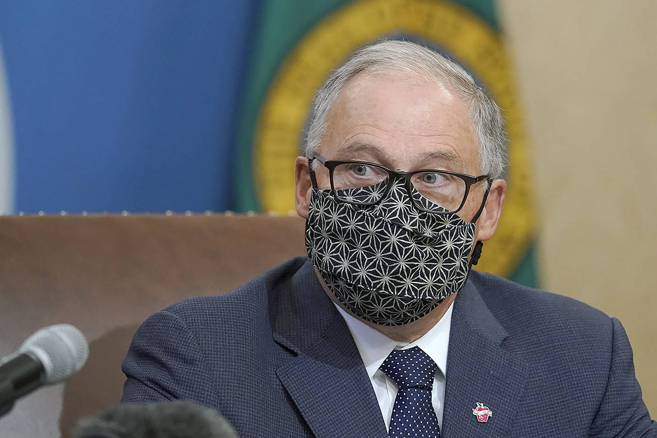 Washington Gov. Jay Inslee speaks during a news conference, Sunday, Nov. 15, 2020, at the Capitol in Olympia, Wash. Inslee announced new restrictions on businesses and social gatherings for the next four weeks as the state continues to combat a rising number of coronavirus cases. (AP Photo/Ted S. Warren)