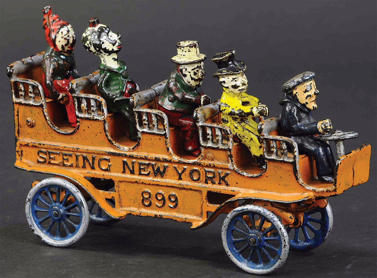 This toy tourist bus was made about 1910 by the Kenton Hardware Co. in Ohio. Not all of the passengers were part of the original toy, but suitable replacements had been found. It is a rare toy — so rare it auctioned for a little over $1,000. (Cowles Syndicate Inc.)