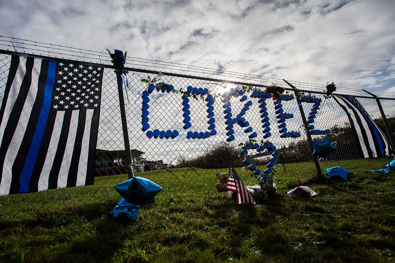 A memorial for Tulalip Tribal Police officer Charlie Cortez at the Tulalip Marina on Wednesday, Nov. 25, 2020 in Tulalip, Wa. (Olivia Vanni / The Herald)