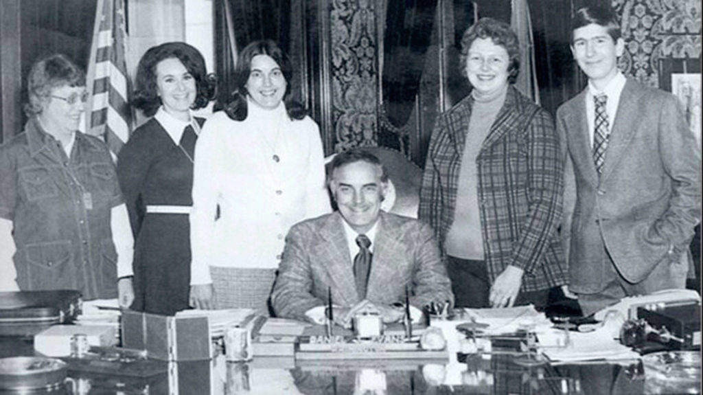 In this 1971 photo, Gov. Dan Evans signs House Bill 90 “Education for All” into law, flanked by the people who wrote and lobbied it into existence: Janet Taggart, Katie Dolan, Cecile Lindquist, Evelyn Chapman, and law student George Breck. Fellow law student Bill Dussault, also part of the team, not pictured. (Submitted photo)
