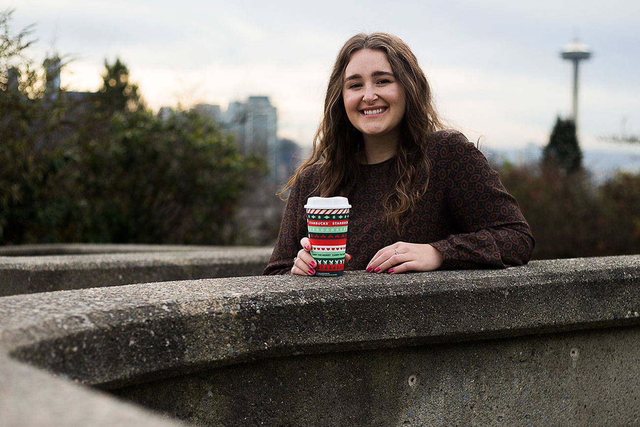 Taylor Mattson, 27, an Everett High School graduate, designed two of Starbucks holiday cups for this year. (Olivia Vanni / The Herald)