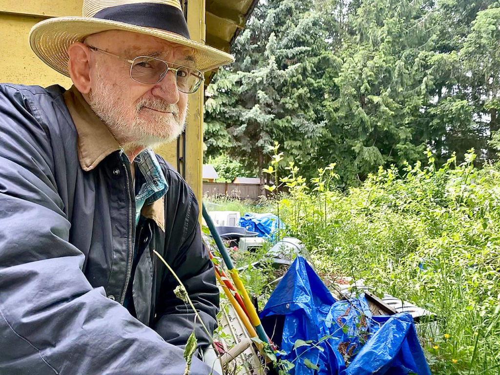 Andy Otter in the backyard of his Marysville home that was in a 2019 episode of the A&E series Hoarders that was picked up by Netflix. (Andrea Brown / The Herald)
