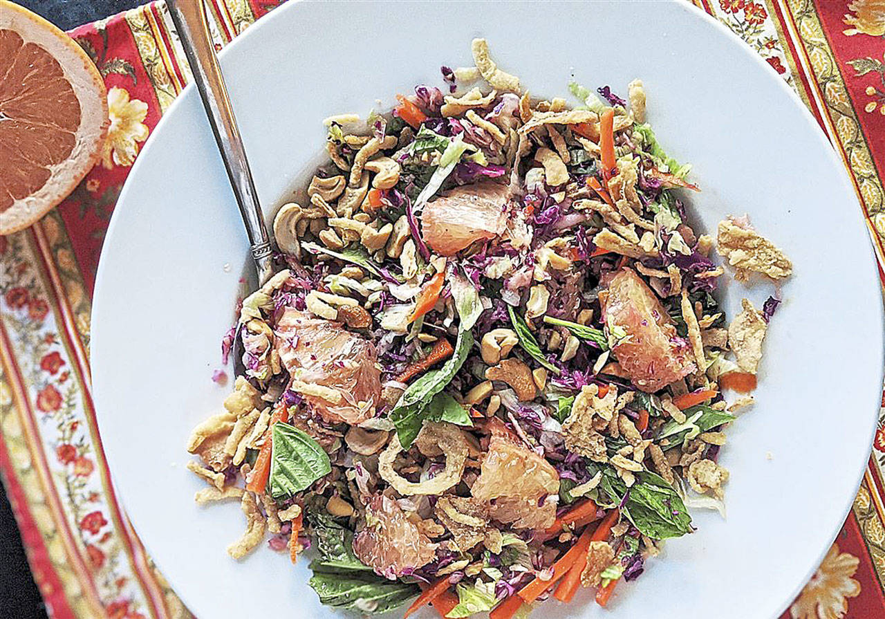 This Thai salad pairs shredded cabbage and carrot with grapefruit, cashews and crispy onion. (Gretchen McKay / Post-Gazette)