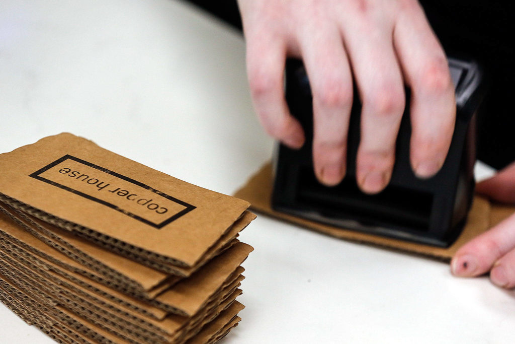 “Copper House” is stamped onto hot-drink collars at Copper House Stanwood. (Kevin Clark / The Herald)
