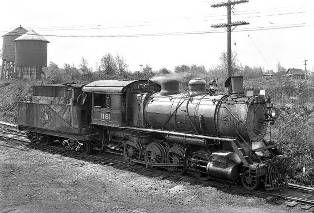 Great Northern locomotive No. 1161, shown in this J.A. Juleen photo taken in 1933 at the Delta Yards in Everett, was built between 1901 and 1907. These F-8 class 2-8-0 locomotives, built to haul freight trains, were originally coal-powered steam engines. By the time this photo was taken, it likely ran on oil. (Everett Public Library, J.A. Juleen)
