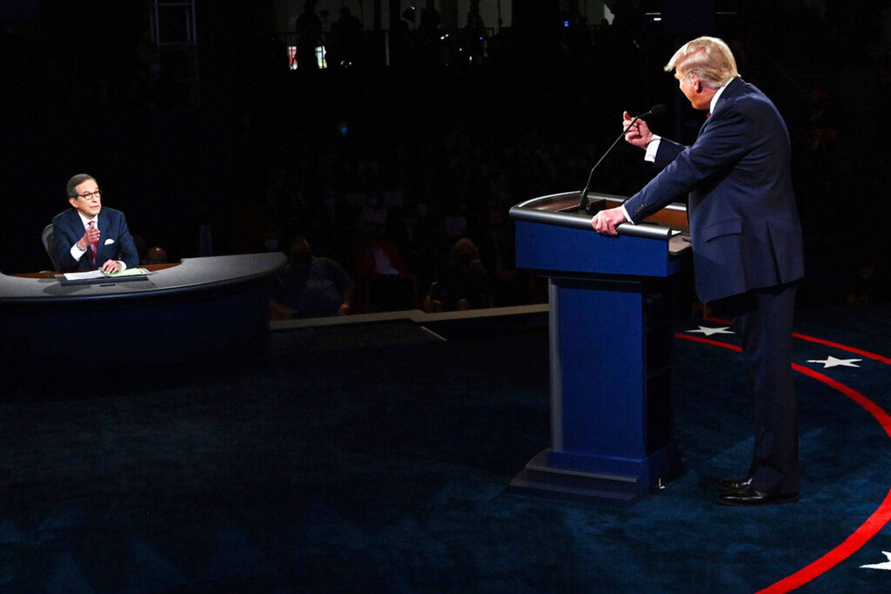 President Trump gestures to moderator Chris Wallace of Fox News during the first presidential debate in Cleveland on Sept. 29. (Olivier Douliery / Associated Press file photo)