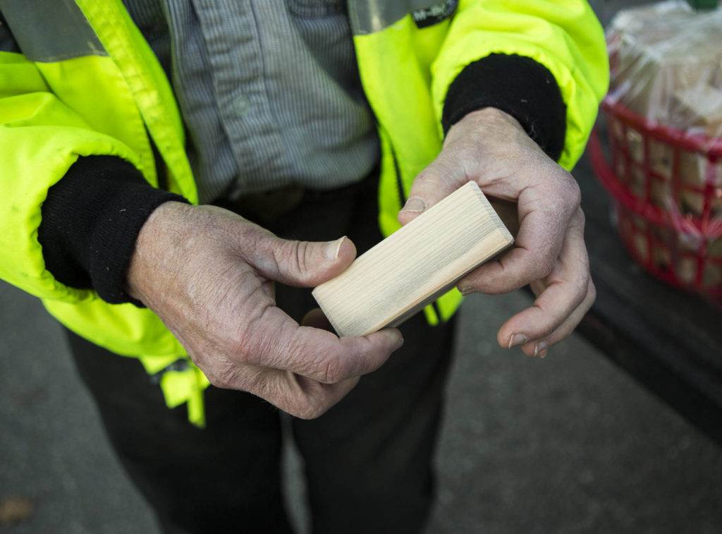 Jon Wilson shows one of the hand-crafted blocks on Wednesday in Monroe. (Olivia Vanni / The Herald)
