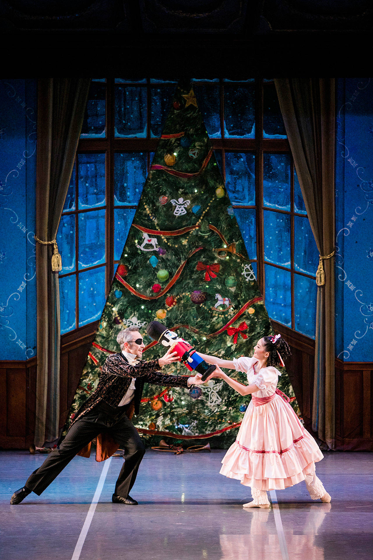 Kaeli Pierce, a student at Olympic Ballet School, plays Young Clara and Frank Borg is Herr Drosselmeyer in last year’s “The Nutcracker.” (Alante Photography)