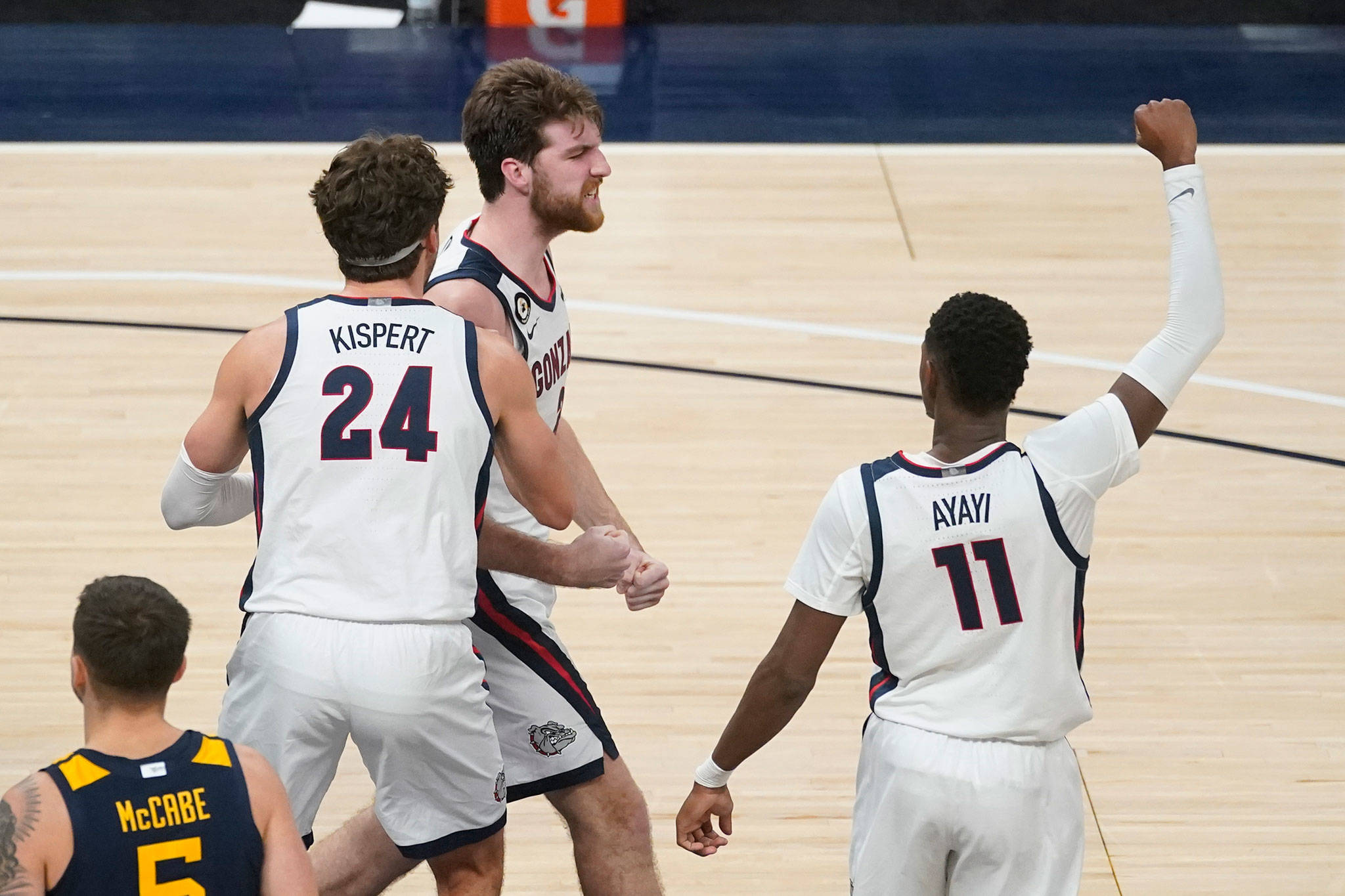 Gonzaga’s Drew Timme (center) celebrates with Corey Kispert (24) and Joel Ayayi (11) during the second half of game against West Virginia on Dec. 2, 2020, in Indianapolis. (AP Photo/Darron Cummings)