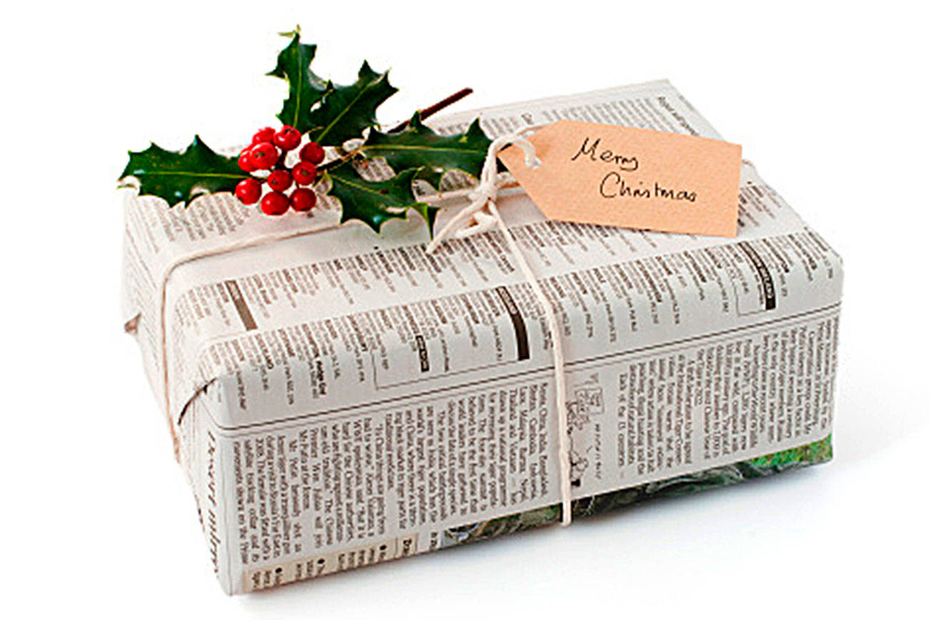 Show your love with sustainable gift-giving and reduce gift waste by wrapping presents with reused materials like newspaper. (Getty Images)