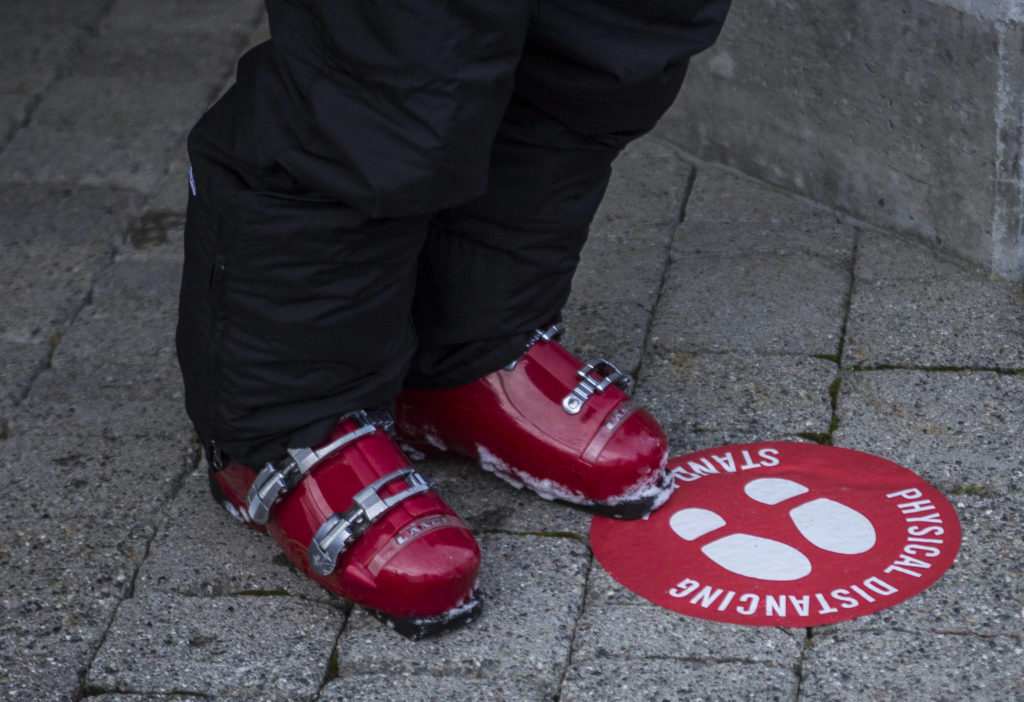 Floor stickers encourage social distancing at Stevens Pass. (Olivia Vanni / The Herald)
