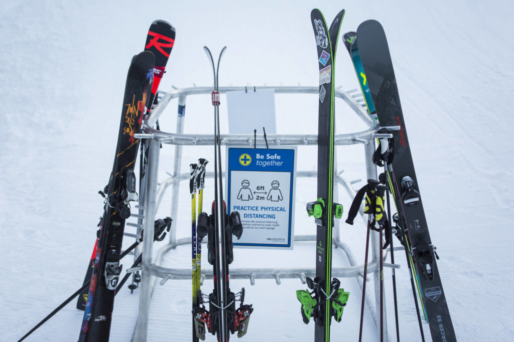 Signs remind people to stay six feet apart at Stevens Pass. (Olivia Vanni / The Herald)
