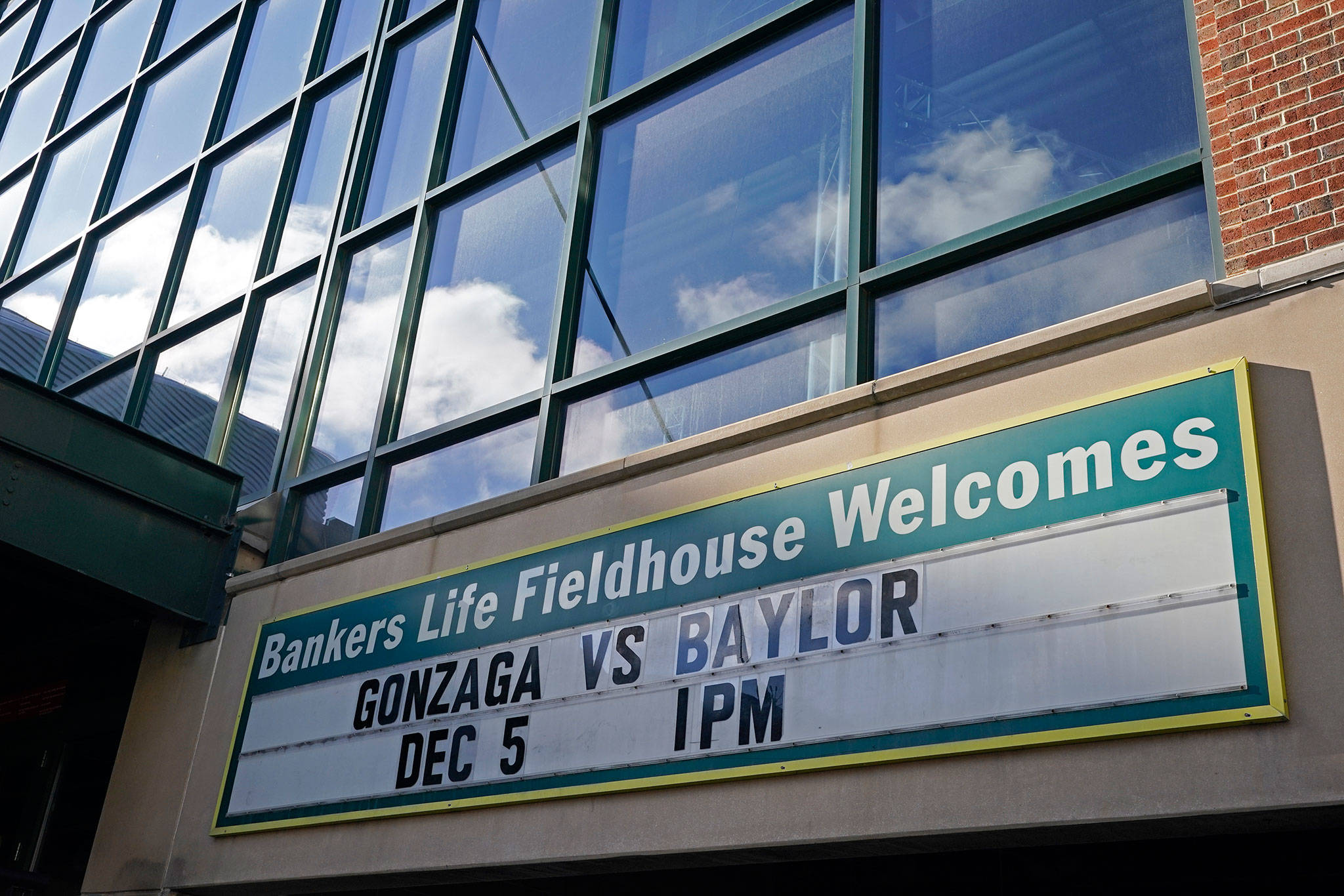 A sign outside of Bankers Life Fieldhouse shows the display for the Gonzaga vs. Baylor basketball game that was scheduled to be played Dec. 5, 2020, in Indianapolis. The game was canceled due to COVID. (AP Photo/Darron Cummings)