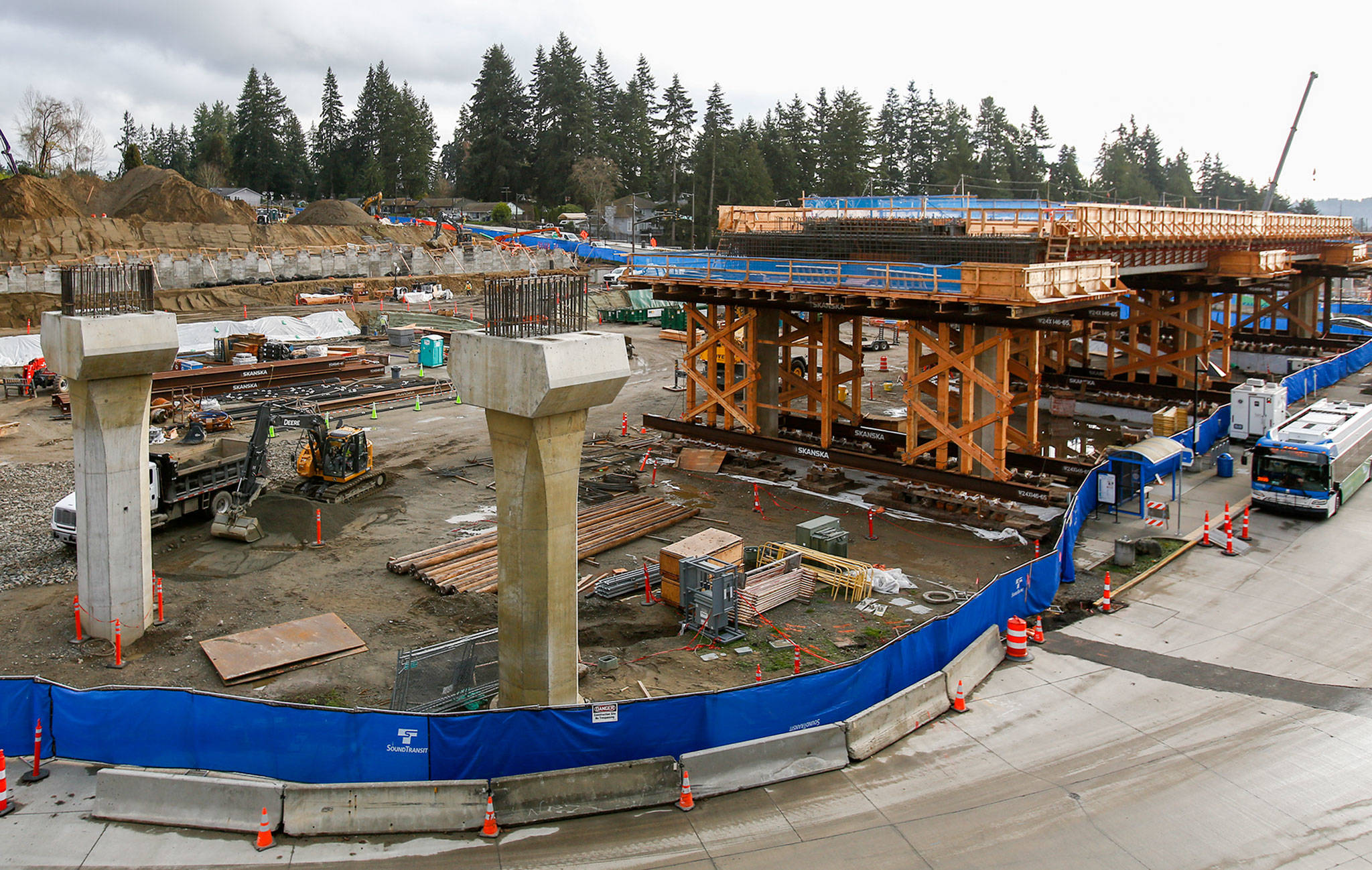 Construction of the light rail extension to Lynnwood continued Friday in Mountlake Terrace, which would not be affected by a decrease in Sound Transit revenue. (Kevin Clark / The Herald)