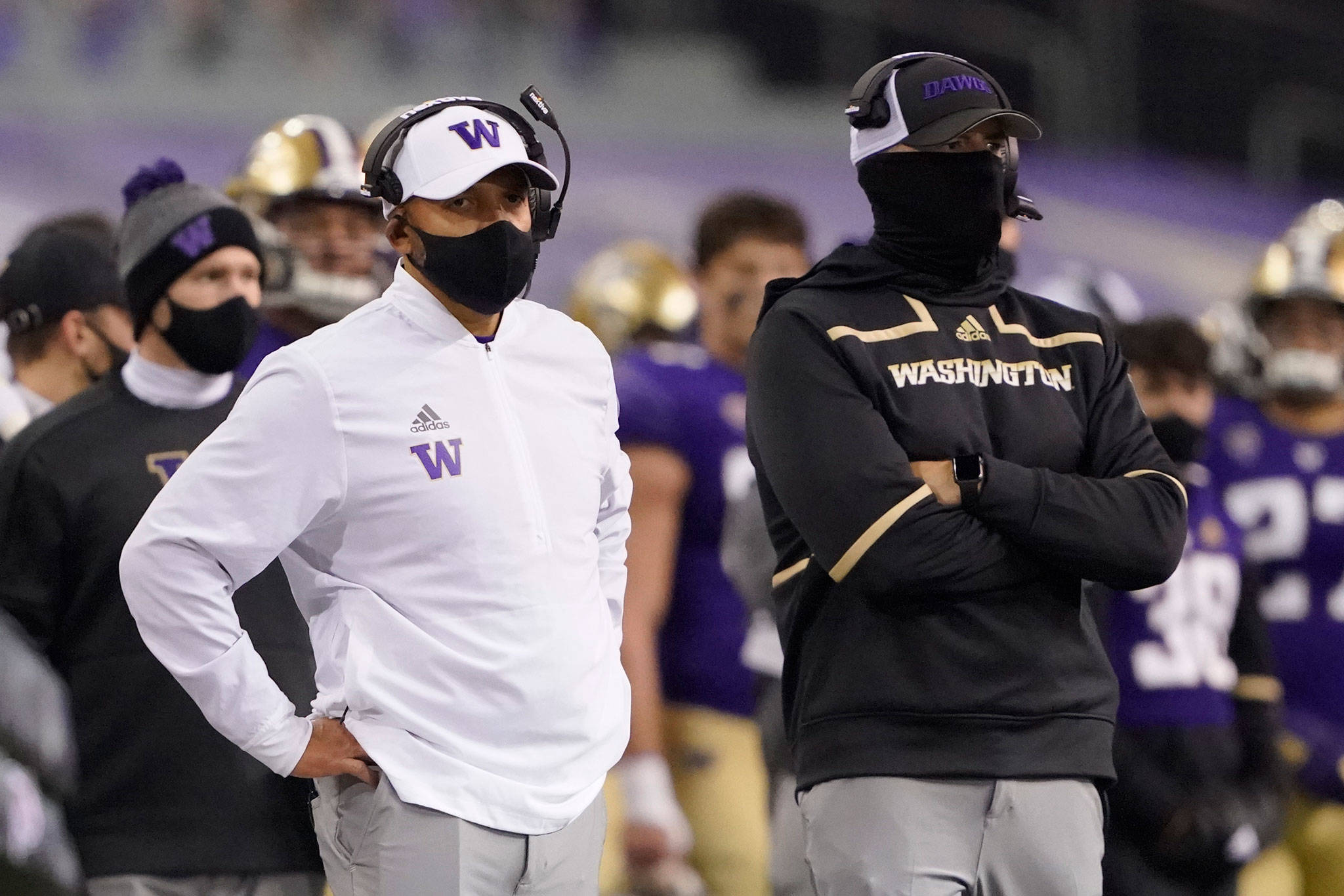 Washington coach Jimmy Lake (left) stands on the sideline with an assistant during the first half of a game against Utah on Nov. 28, 2020, in Seattle. (AP Photo/Ted S. Warren)