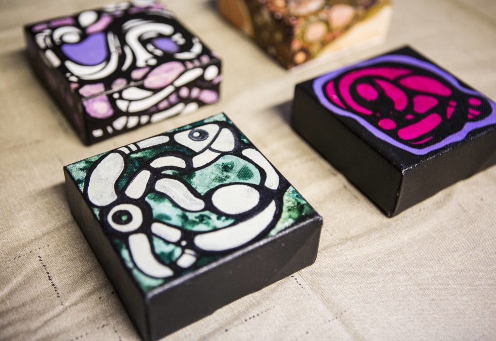 Lu Hernandez created these four small mixed-media pieces with acrylic and alcohol ink. (Olivia Vanni / The Herald)
