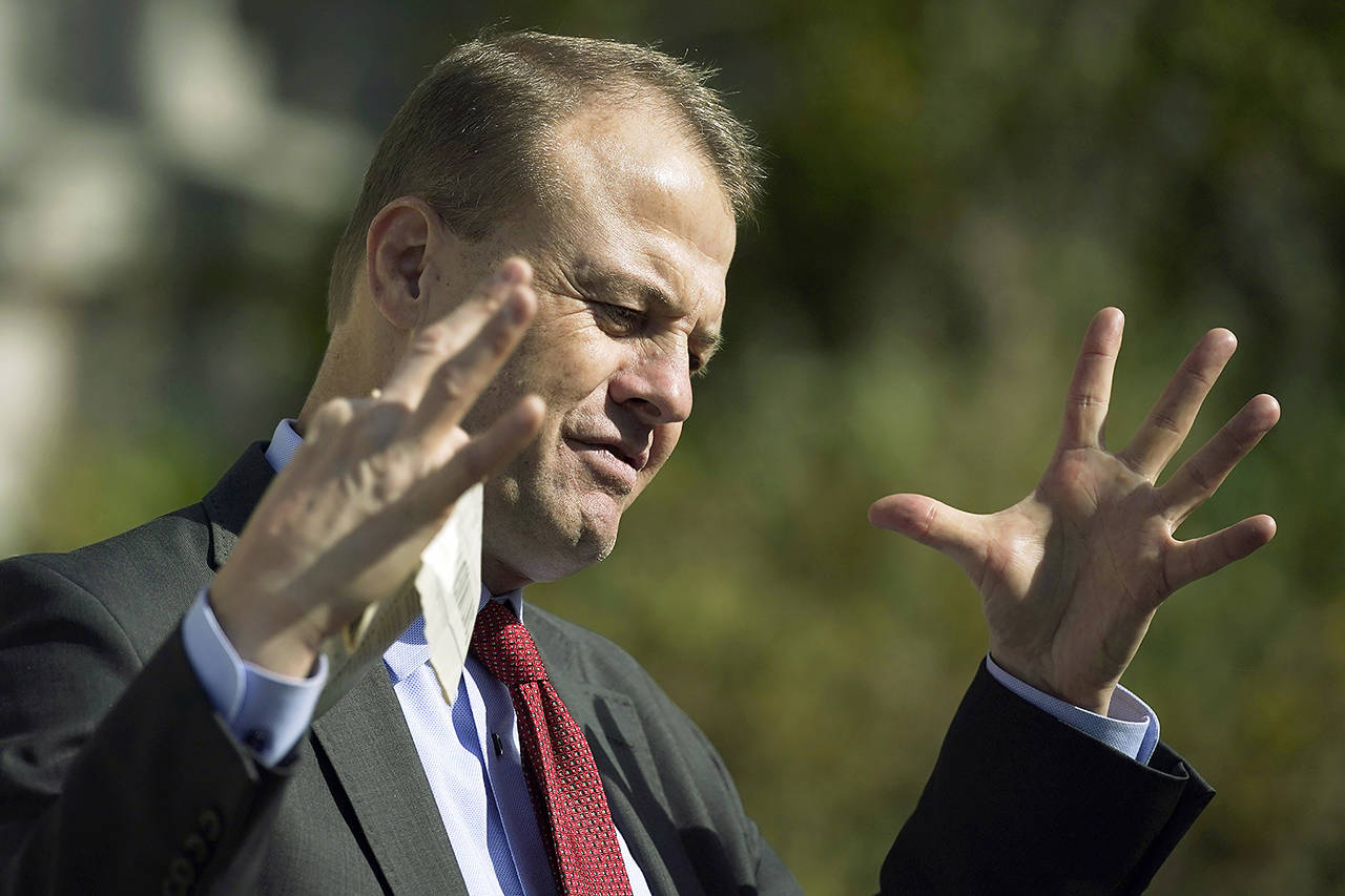 Initiative promoter Tim Eyman talks to reporters Oct. 15 in Olympia. (Associated Press)