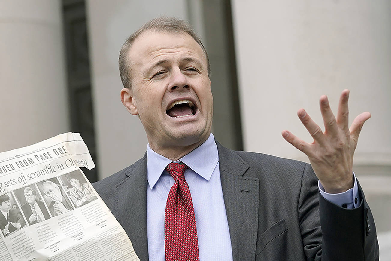 Initiative promoter Tim Eyman talks to reporters, Thursday, Oct. 15, 2020, in front of the Temple of Justice at the Capitol in Olympia, Wash. The Washington Supreme Court on Thursday unanimously struck down Eyman's Initiative 976, a measure that would have steeply discounted the price of car registrations at $30 while gutting transportation budgets across Washington state. (AP Photo/Ted S. Warren)