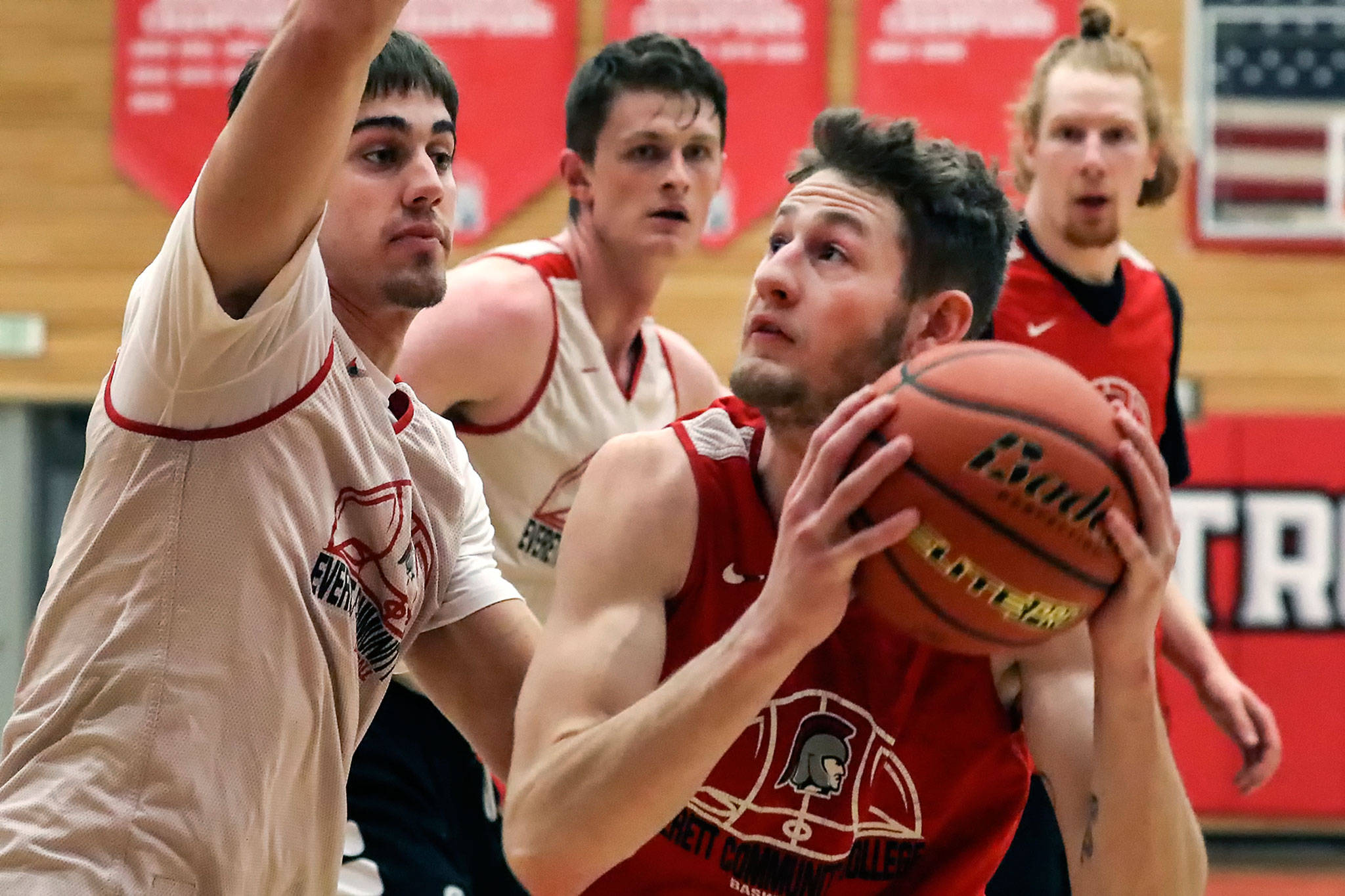 Everett Community College’s Cameron Underwood (right) looks to the basket during a practice on March 2, 2020, in Everett. (Kevin Clark / The Herald)