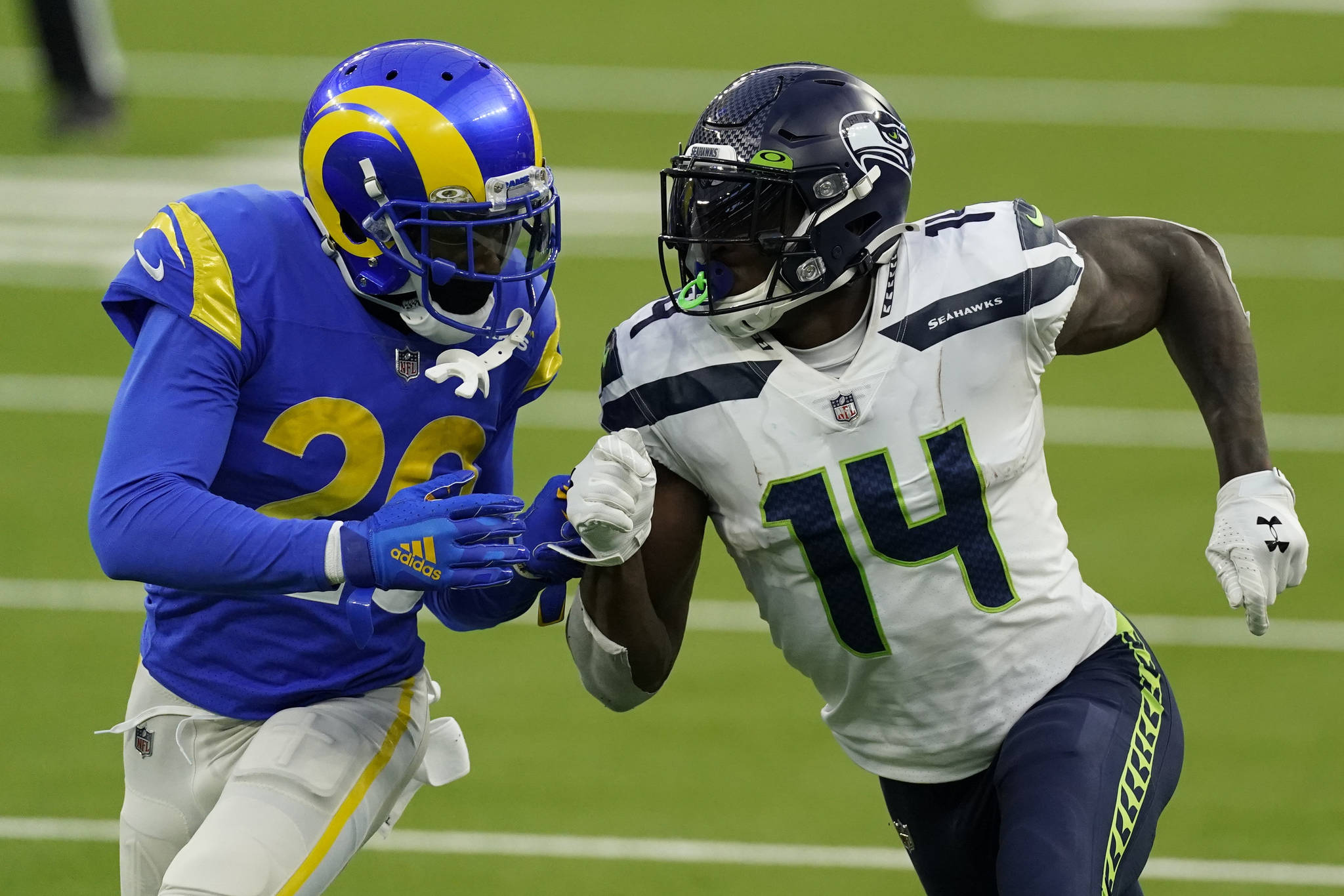Seattle Seahawks wide receiver DK Metcalf (14) is defended by Los Angeles Rams cornerback Jalen Ramsey (20) during the the Rams’ 23-16 victory on Nov. 15 at SoFi Stadium. (AP Photo/Ashley Landis)