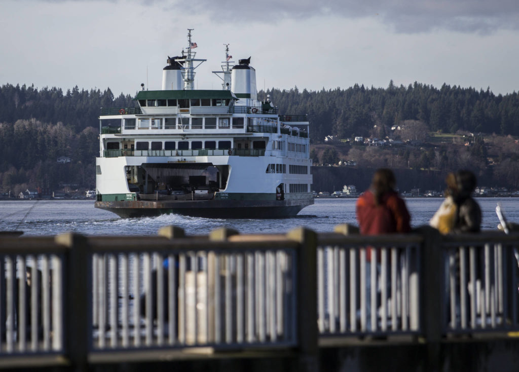 A ferry leaves the Mukilteo terminal on Tuesday. Washington State Ferries is asking people to limit travel this year. (Olivia Vanni / The Herald)
