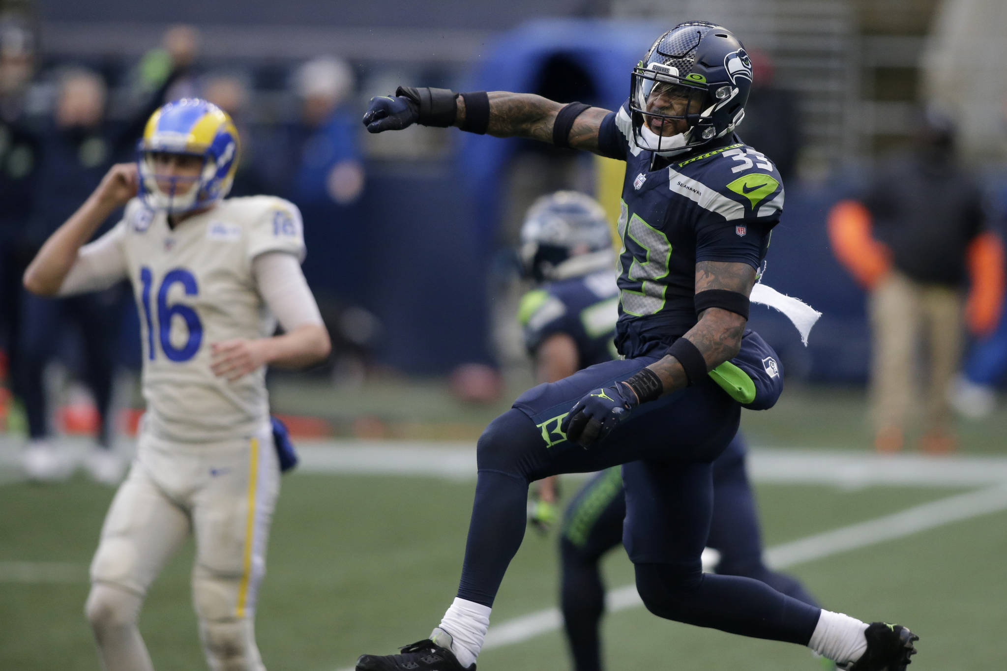 Seattle Seahawks strong safety Jamal Adams (33) reacts to a play with Los Angeles Rams quarterback Jared Goff (16) in the background, during the second half Sunday at Lumen Field. (AP Photo/Scott Eklund)