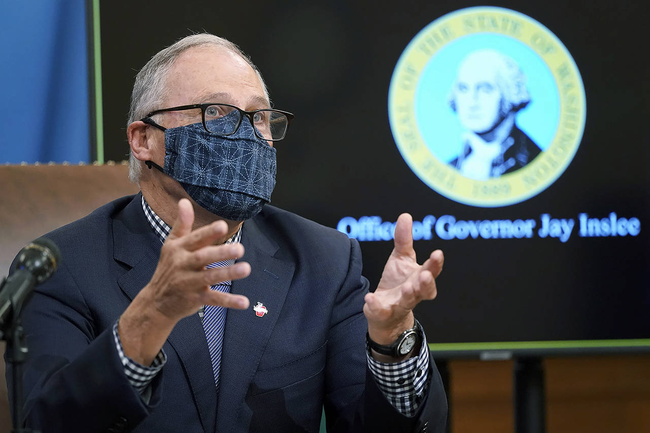 In this Dec. 17 photo, Washington Gov. Jay Inslee talks to reporters at the Capitol in Olympia. (AP Photo/Ted S. Warren, File)