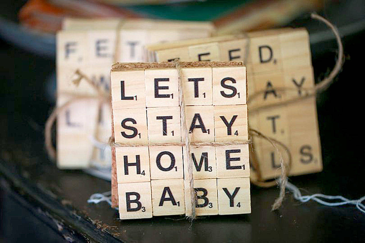 Denise Perkins makes coasters out of Scrabble letters, as well as beeswax candles and crystal sun catchers. (Farage Photography)
