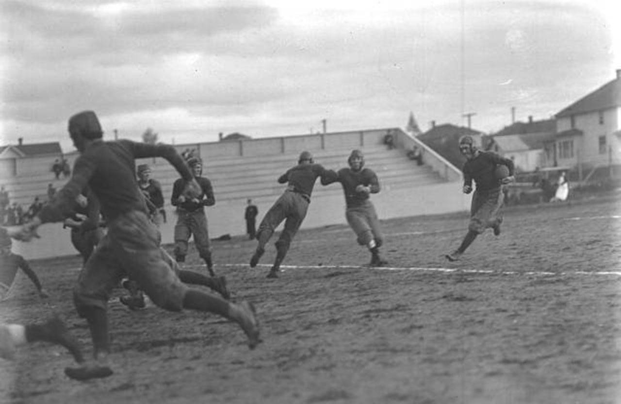 Everett High School’s Dan Michel carries the ball during a Oct. 4, 1913 game against Bellingham at Athletic Field in Everett. (Everett Public Library Northwest History Room)