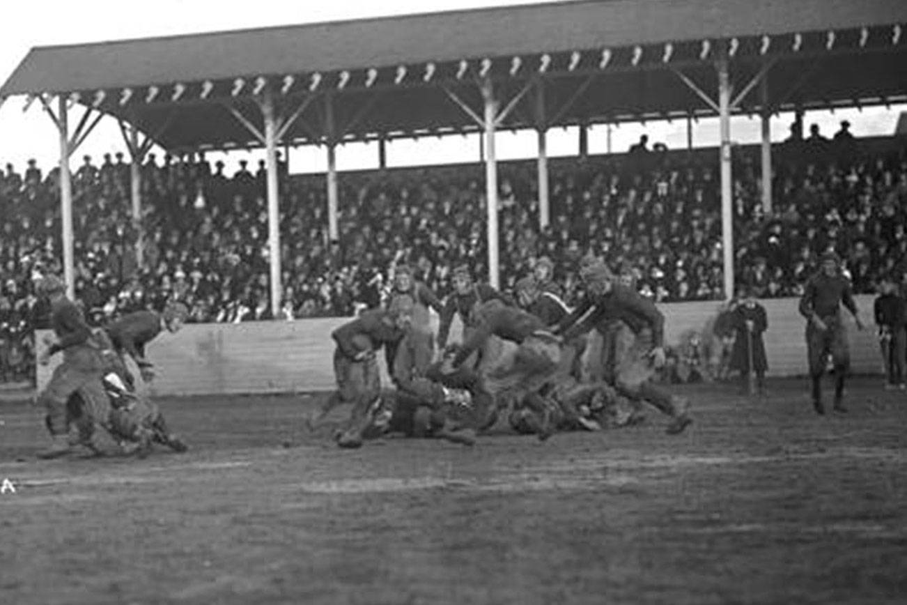 The Everett football team plays a 1914 game at Athletic Field in Everett. (Everett Public Library Northwest History Room)