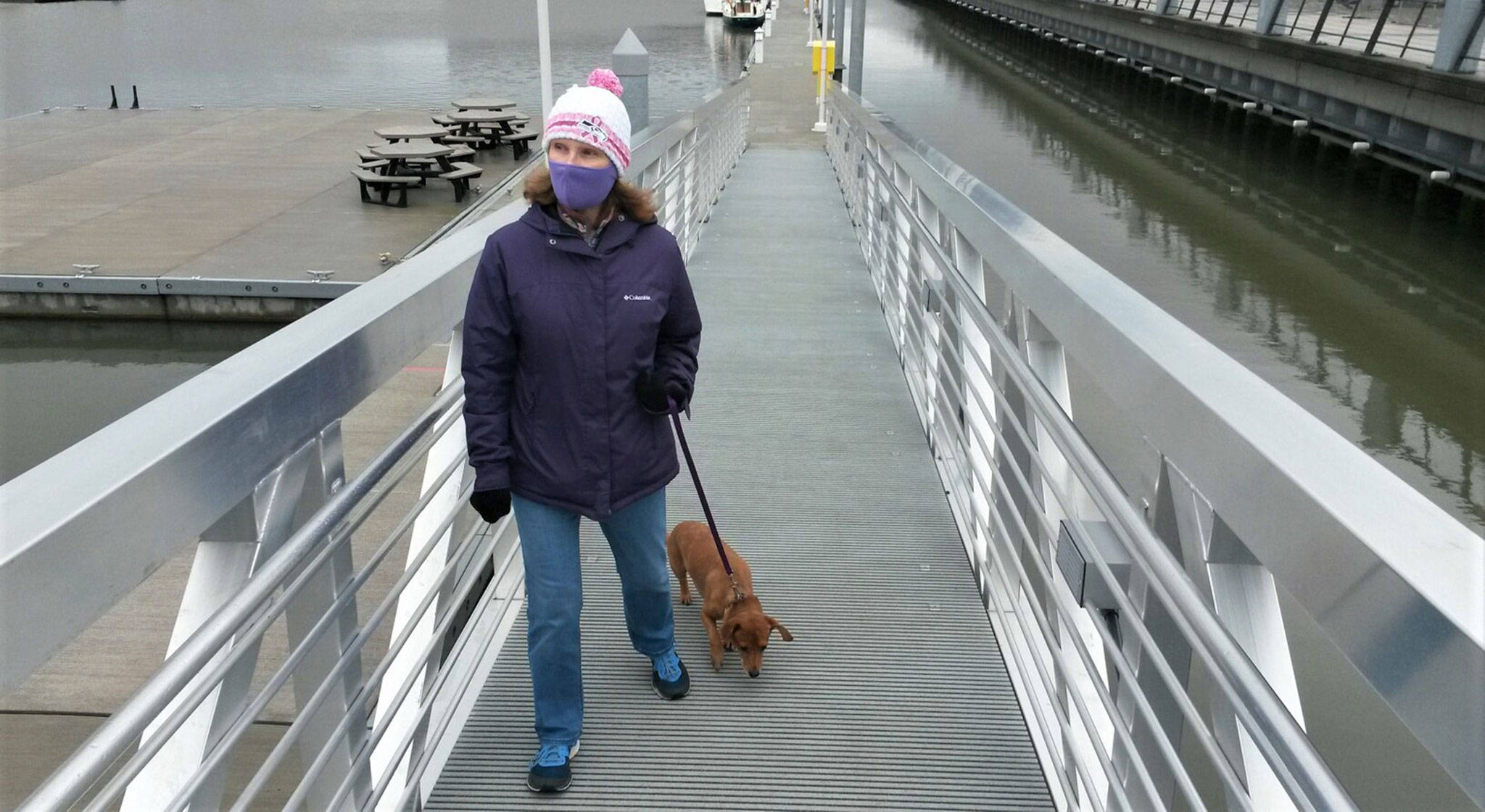 Julie Muhlstein and her dog, Oscar, out for a walk last week at the Everett waterfront. (Contributed photo)